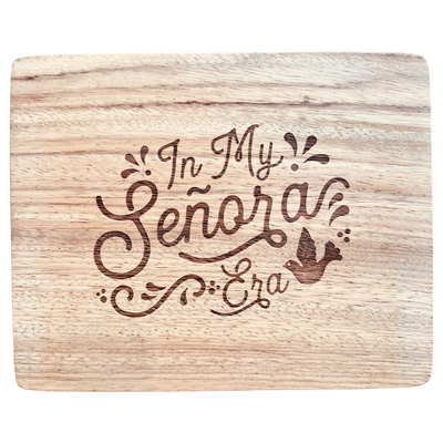 Retangular wood cutting board featuring a laser etched graphic in the center that reads "In My Señora Era"