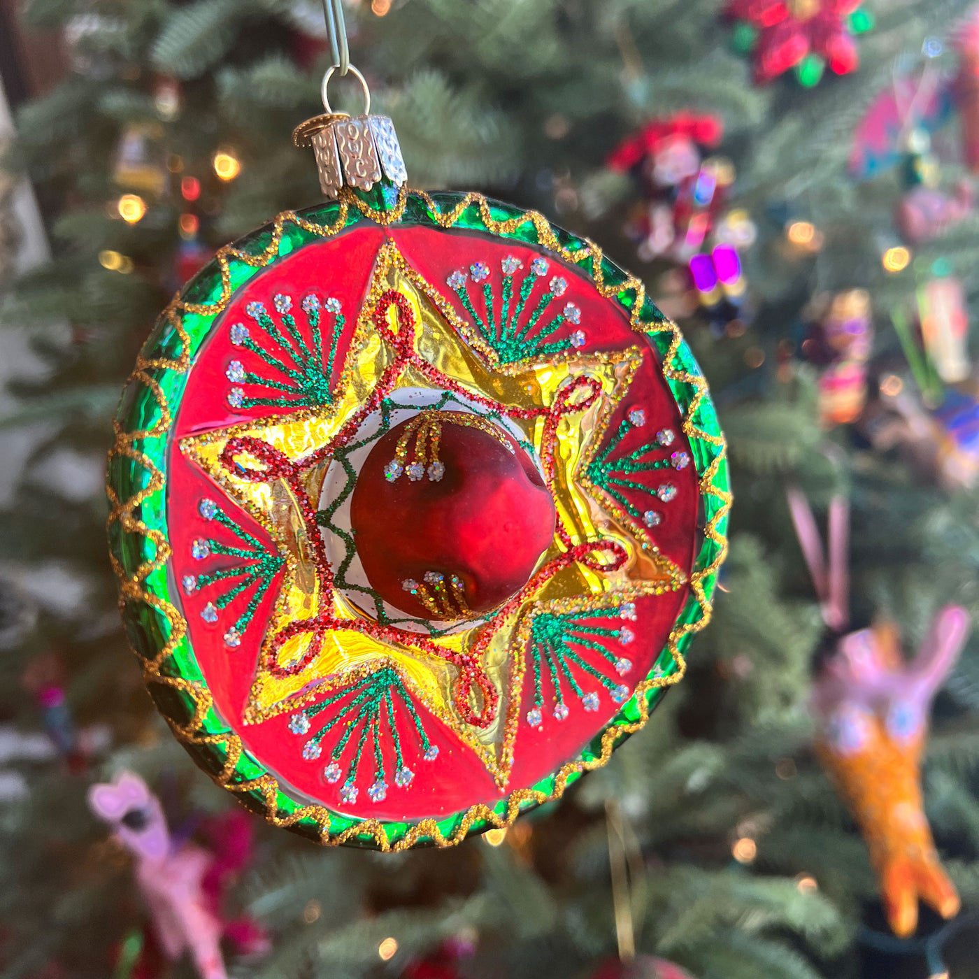 photo of a glass sombrero christmas ornament with glitter details