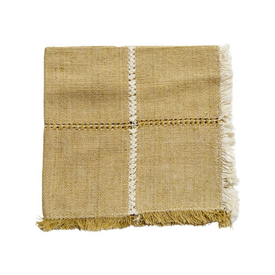 Tan with a cream stripe down the center handwoven napkin folded in quarters.