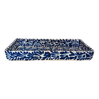 side view of a blue and white Puebla design ceramic dish