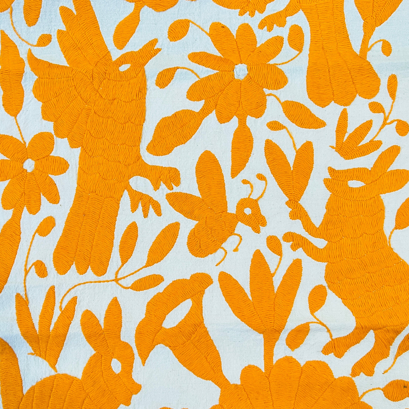 Collection photo for our "Shop By Color: Orange" collection. Image is a orange otomi table runner.