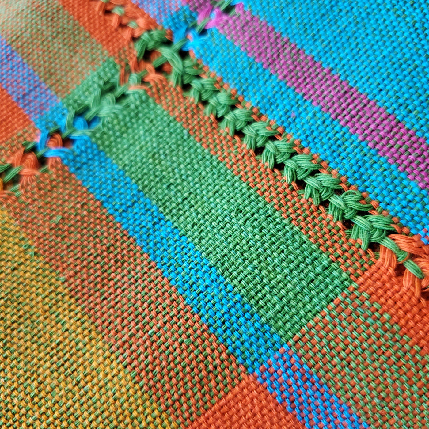 Collection photo for our "Shop By Color: Multicolor" collection. Image showcases enhanced details of one of our multicolor woven napkins