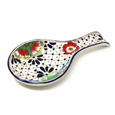ceramic spoon rest with a multi color floral and dots design