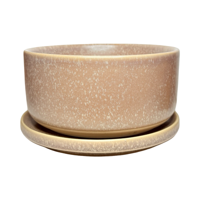 Light purple stoneware bowl with a speckled glaze, stacked on a matching plate with a smooth, matte finish