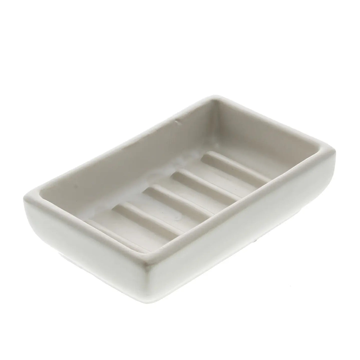 white ceramic soap dish with ridges inside it