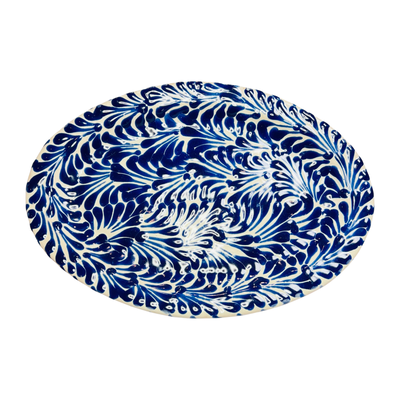 top view of a oval blue and white talavera dish