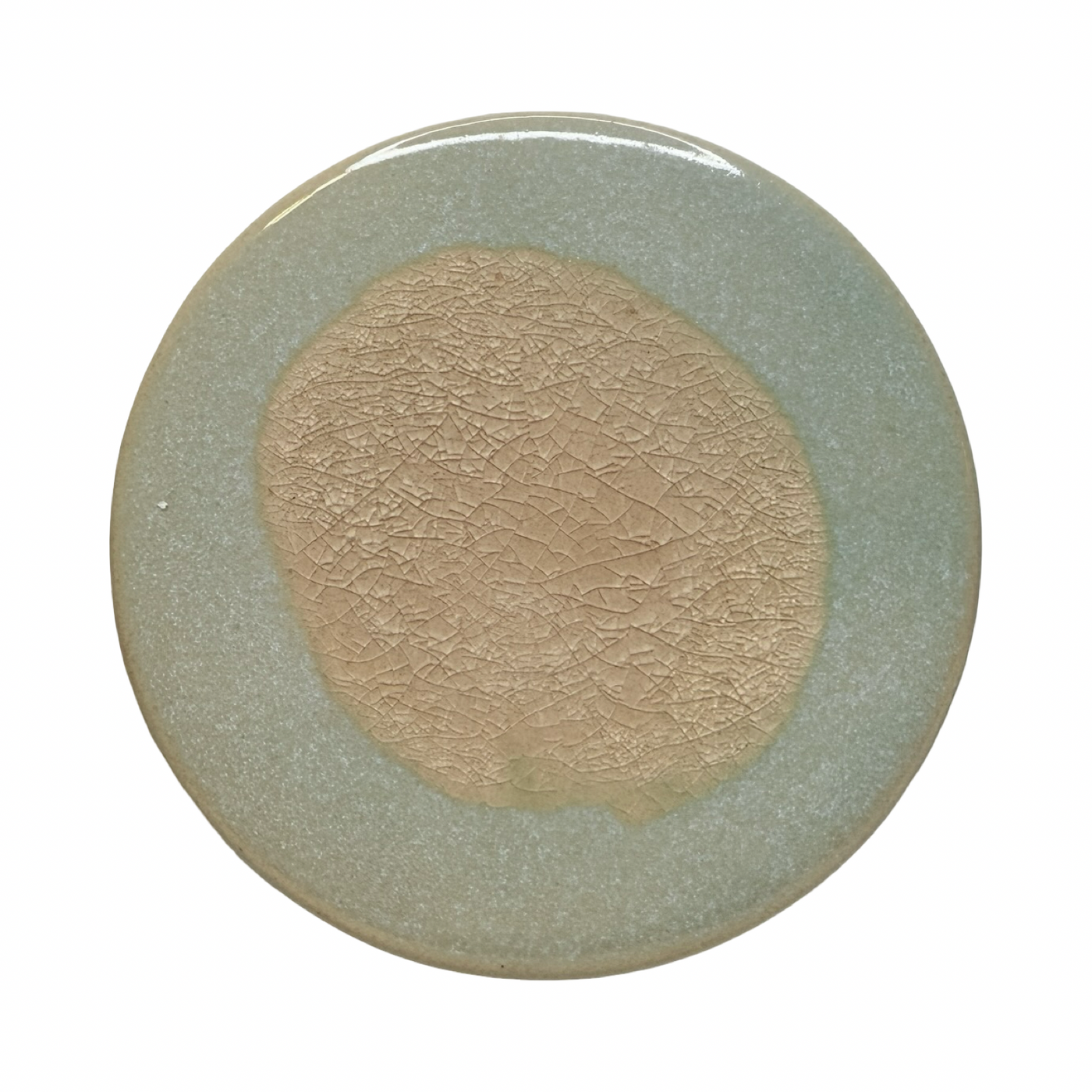 light grey round stoneware trivet with two-tone reactive glaze, showing slight variations in finish.