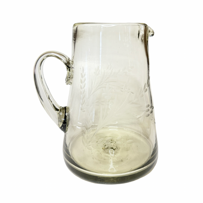 Clear glass pitcher with floral etching