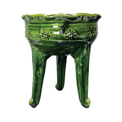 Green ceramic copalero featuring a stamped design.