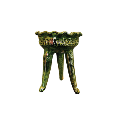Green ceramic copalero featuring a stamped design.