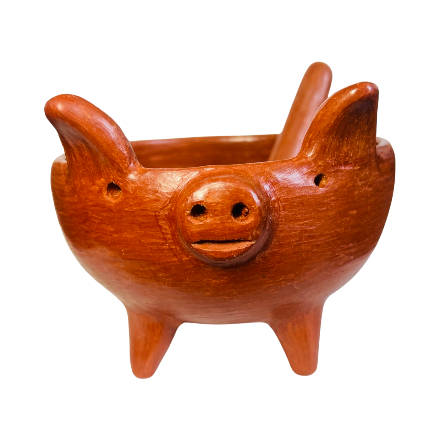 front view of red clay handsculpted spoon and bowl with pig legs and pig facial features