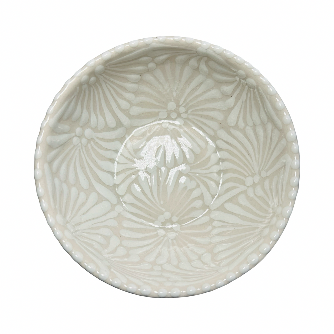 top view of a ceramic bowl with white and cream Puebla design