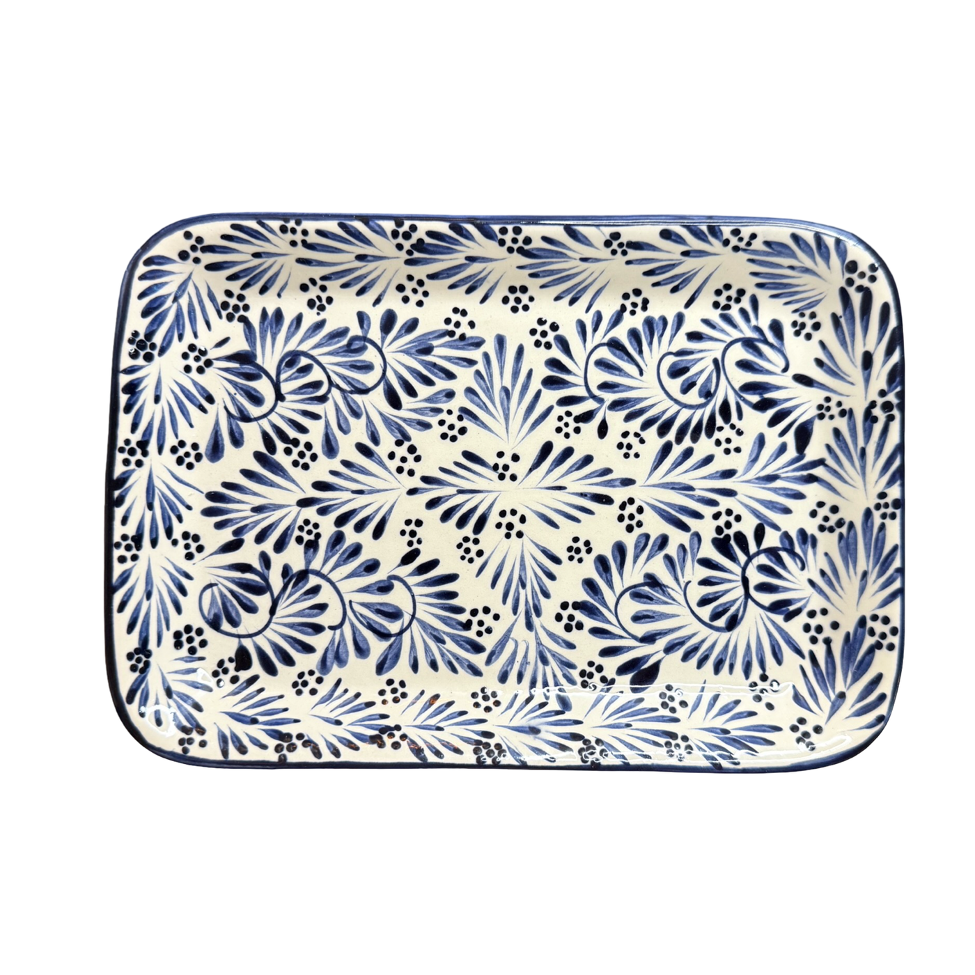Top view of a Rectangular ceramic serving platter hand-painted with blue plumeado feather-style designs on a cream background.
