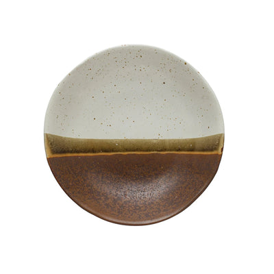 stoneware low bowl featuring a two-tone glaze in brown and beige with a subtle dividing line.