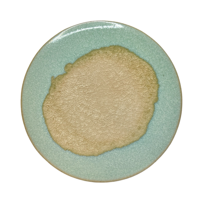 Aqua round stoneware trivet with two-tone reactive glaze, showing slight variations in finish.