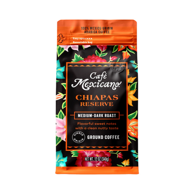 12 oz Bag of Café Mexicano Chiapas Reserve ground coffee with an orange floral design, labeled as a medium-dark roast with sweet notes and a clean nutty taste.