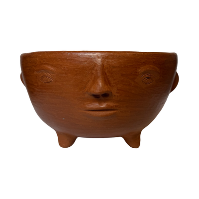 round barro rojo (red clay) planter with a face and ears.