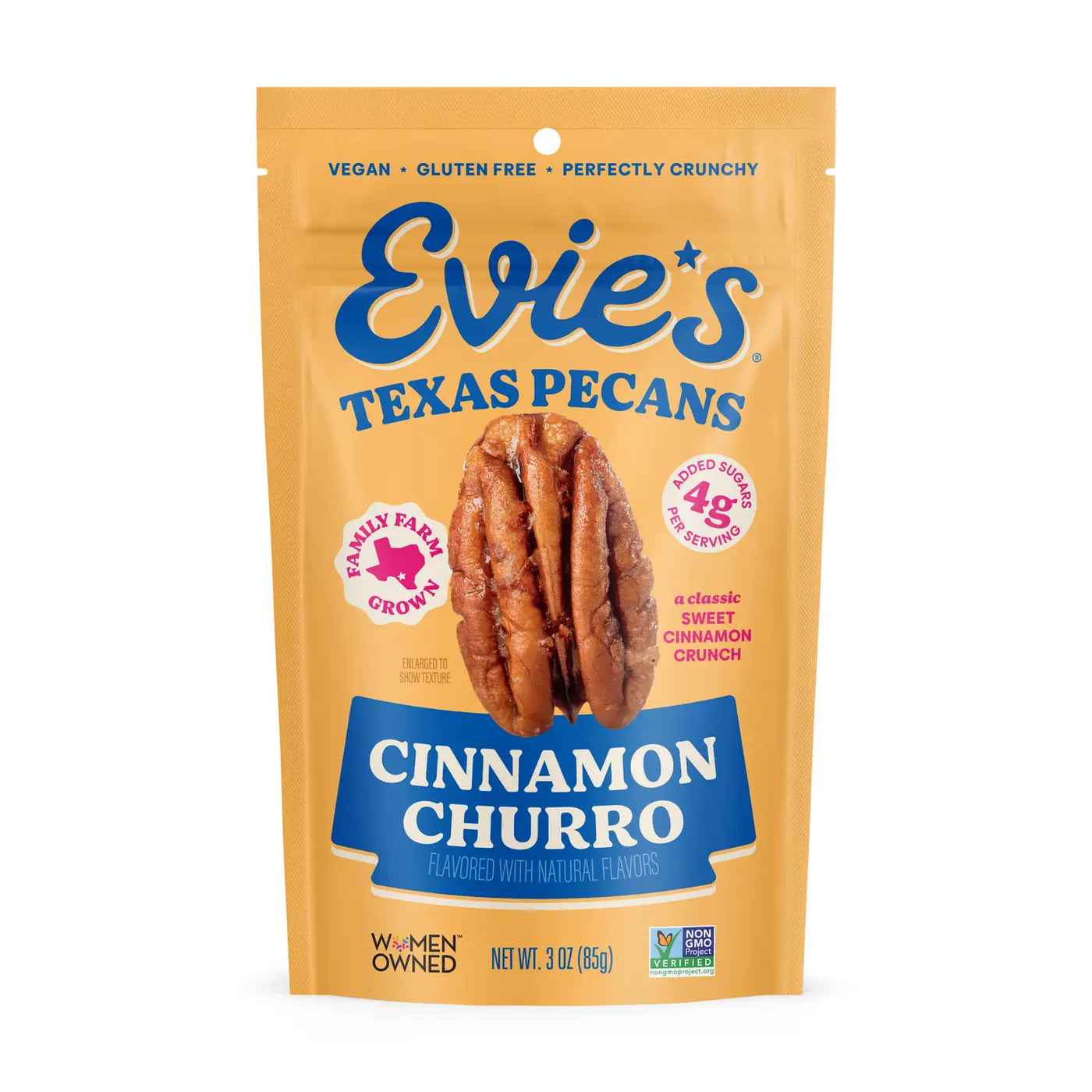 Yellow pouch of Evie’s Texas Pecans labeled “Cinnamon Churro,” featuring pecan imagery and notes of vegan, gluten-free, and Non-GMO verified.