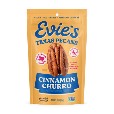 Yellow pouch of Evie’s Texas Pecans labeled “Cinnamon Churro,” featuring pecan imagery and notes of vegan, gluten-free, and Non-GMO verified.
