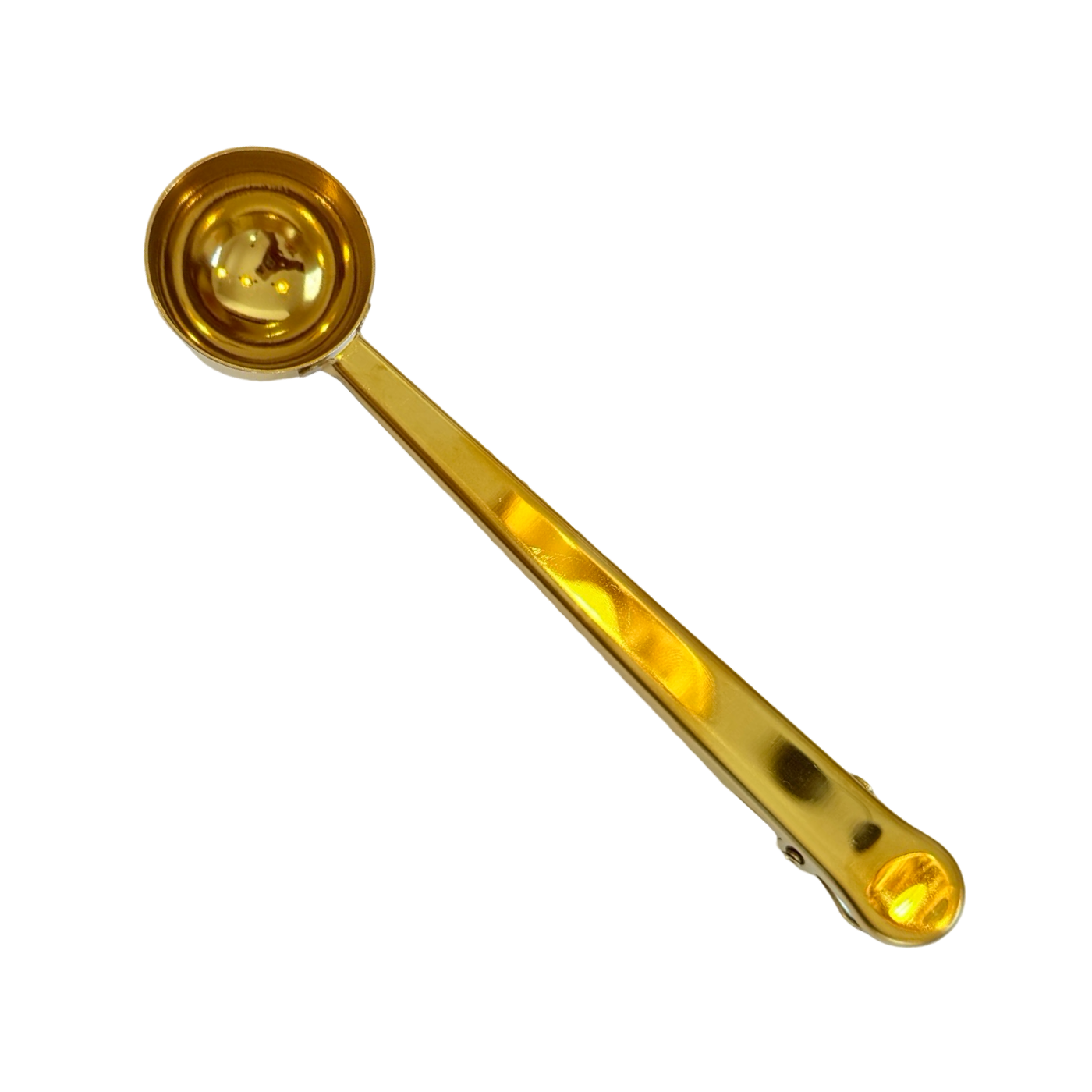 A gold coffee or tea scoop with a built-in clip