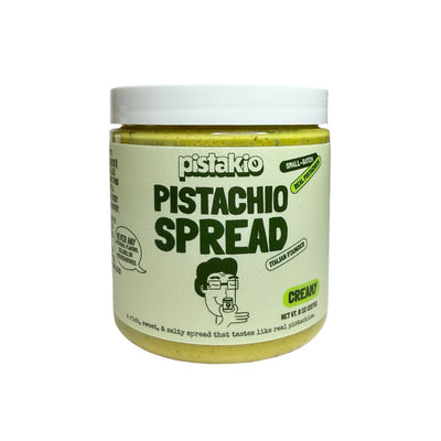 Jar of pistachio spread with a white lid 