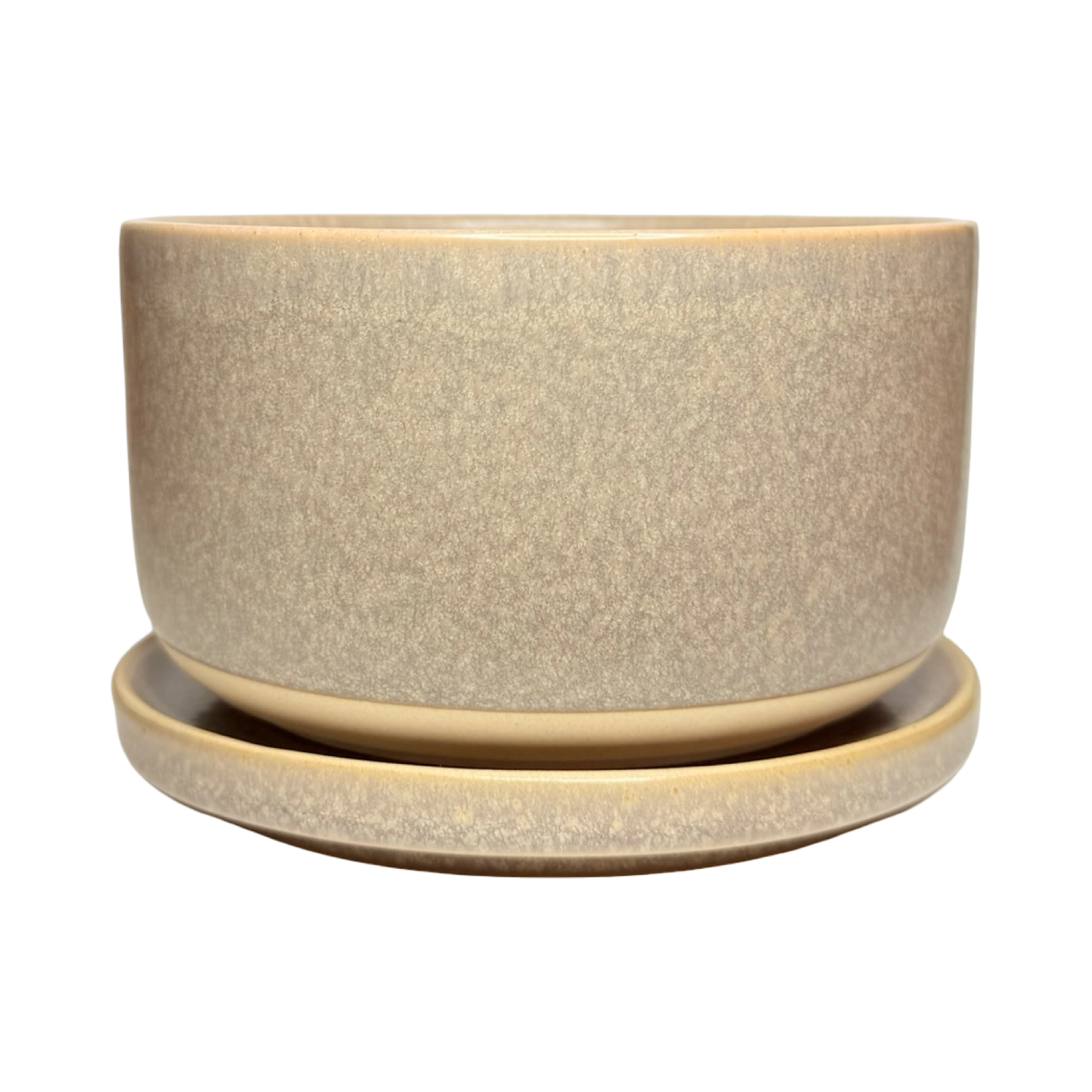 Light purple stoneware bowl with a speckled glaze, stacked on a matching plate with a smooth, matte finish.