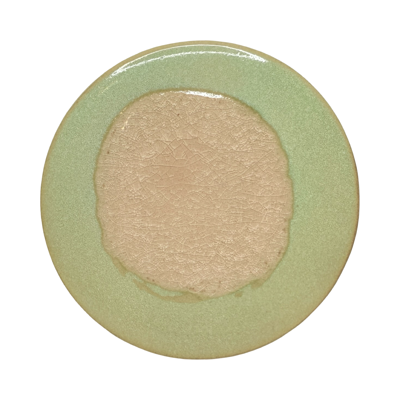 Light green round stoneware trivet with two-tone reactive glaze, showing slight variations in finish.