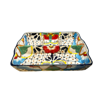 Rectangular ceramic divided platter with three sections, hand-painted with colorful flowers, leaves, and dotted patterns.