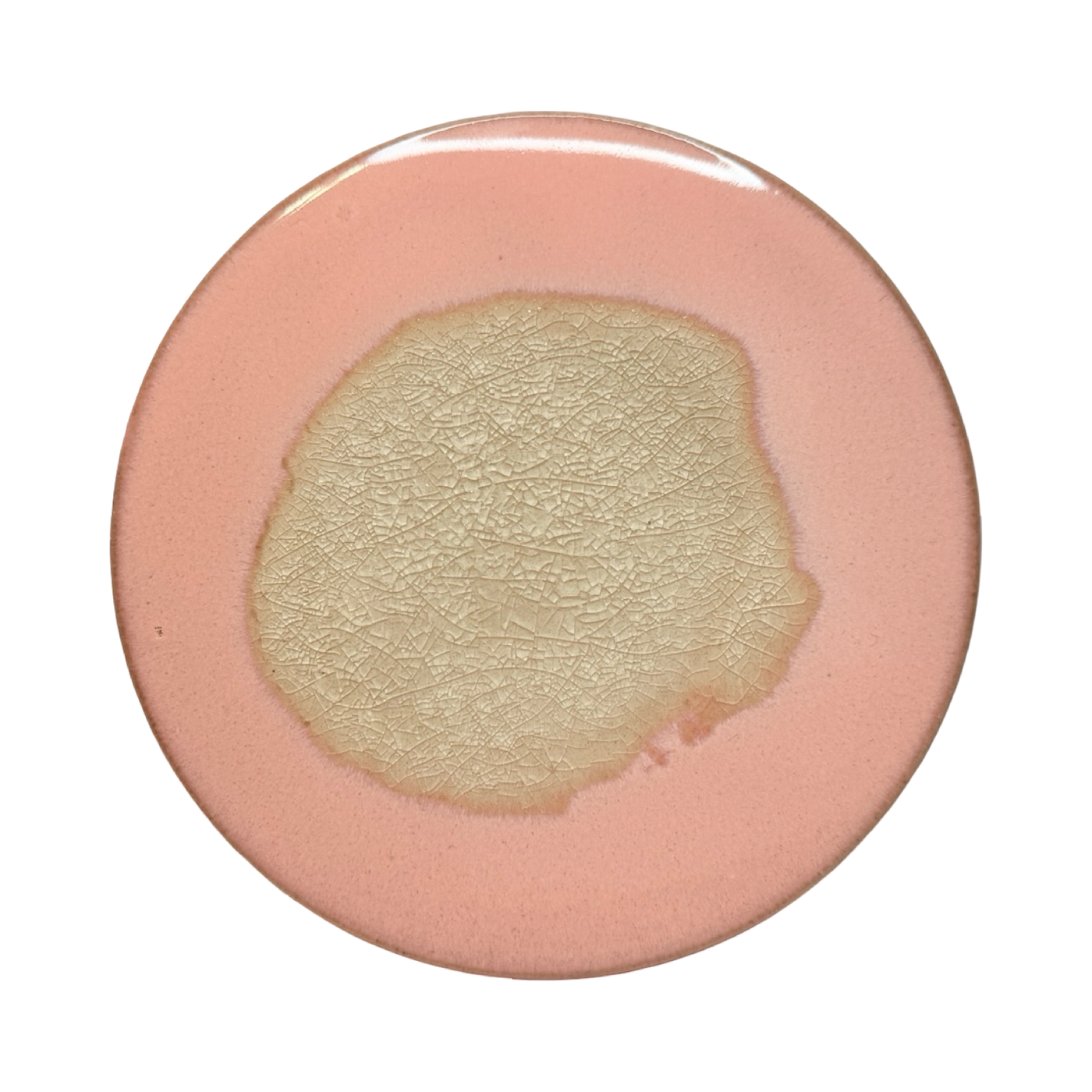 light pink round stoneware trivet with two-tone reactive glaze, showing slight variations in finish.