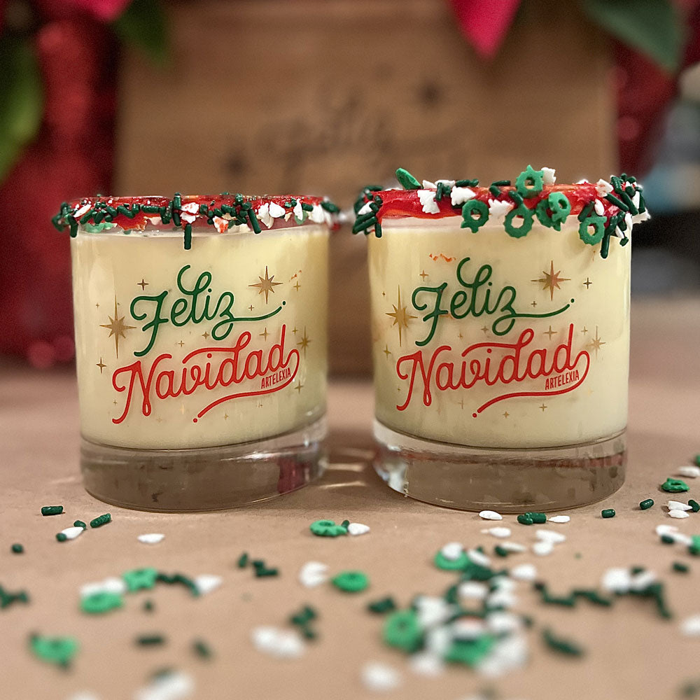 clear 11 oz glass with the phrase feliz navidad in red and green and with gold stars