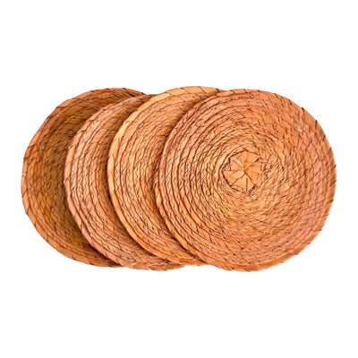 set of four light salmon colored round palm coasters