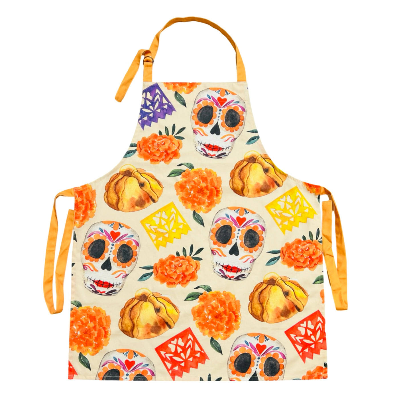 beige apron with images of sugar skulls, pan de muerto, marigolds and papel picado banner featuring orange waist and neck ties.