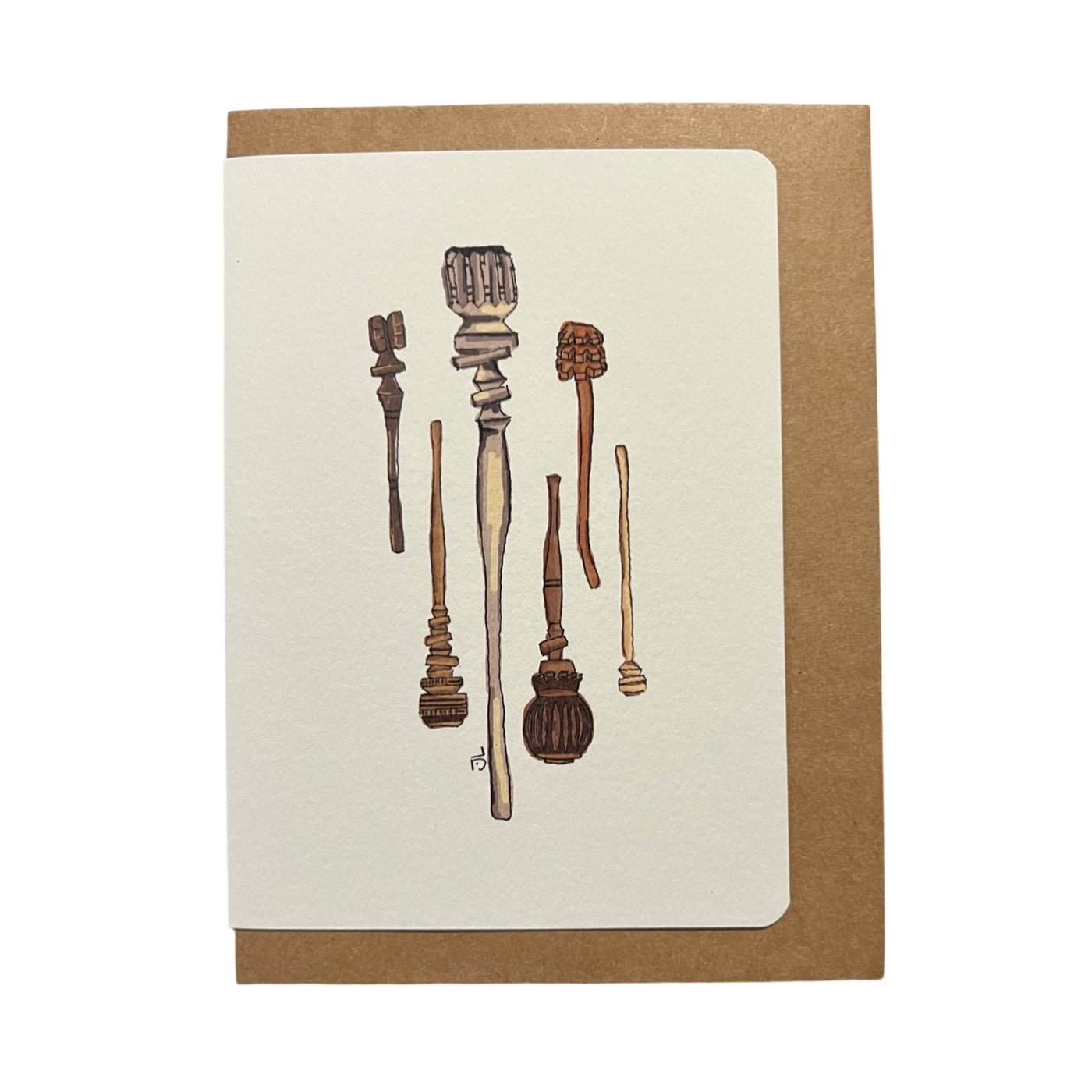 A greeting card featuring an illustration of various traditional molinillos, wooden whisks used for frothing Mexican hot chocolate, displayed in a charming, hand-drawn style