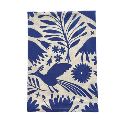 quarter folded cream towel with a blue otomi design