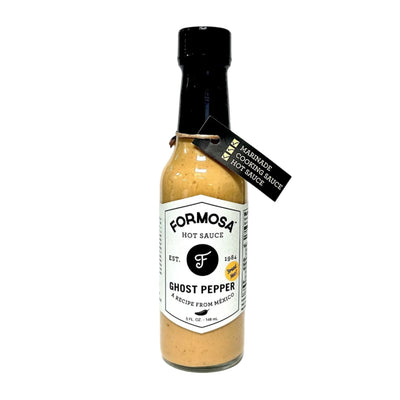 5 oz Bottle of Formosa Ghost Pepper Hot Sauce with black cap and white label, featuring "Ghost Pepper – A Recipe from Mexico" text and a black tag reading “Marinade, Cooking Sauce, Hot Sauce.”