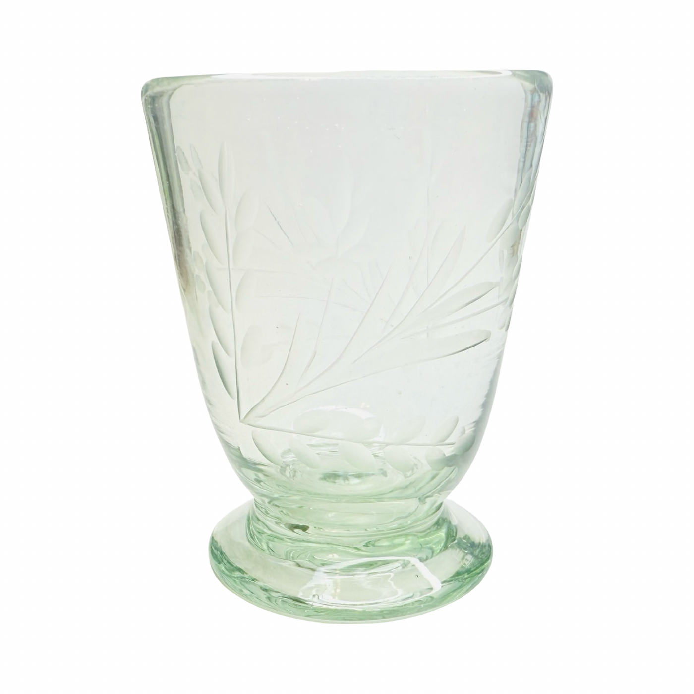 Clear glass with etched leaf pattern on a white background