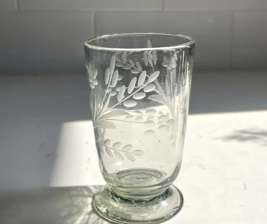 Clear glass tumbler with leaf etching