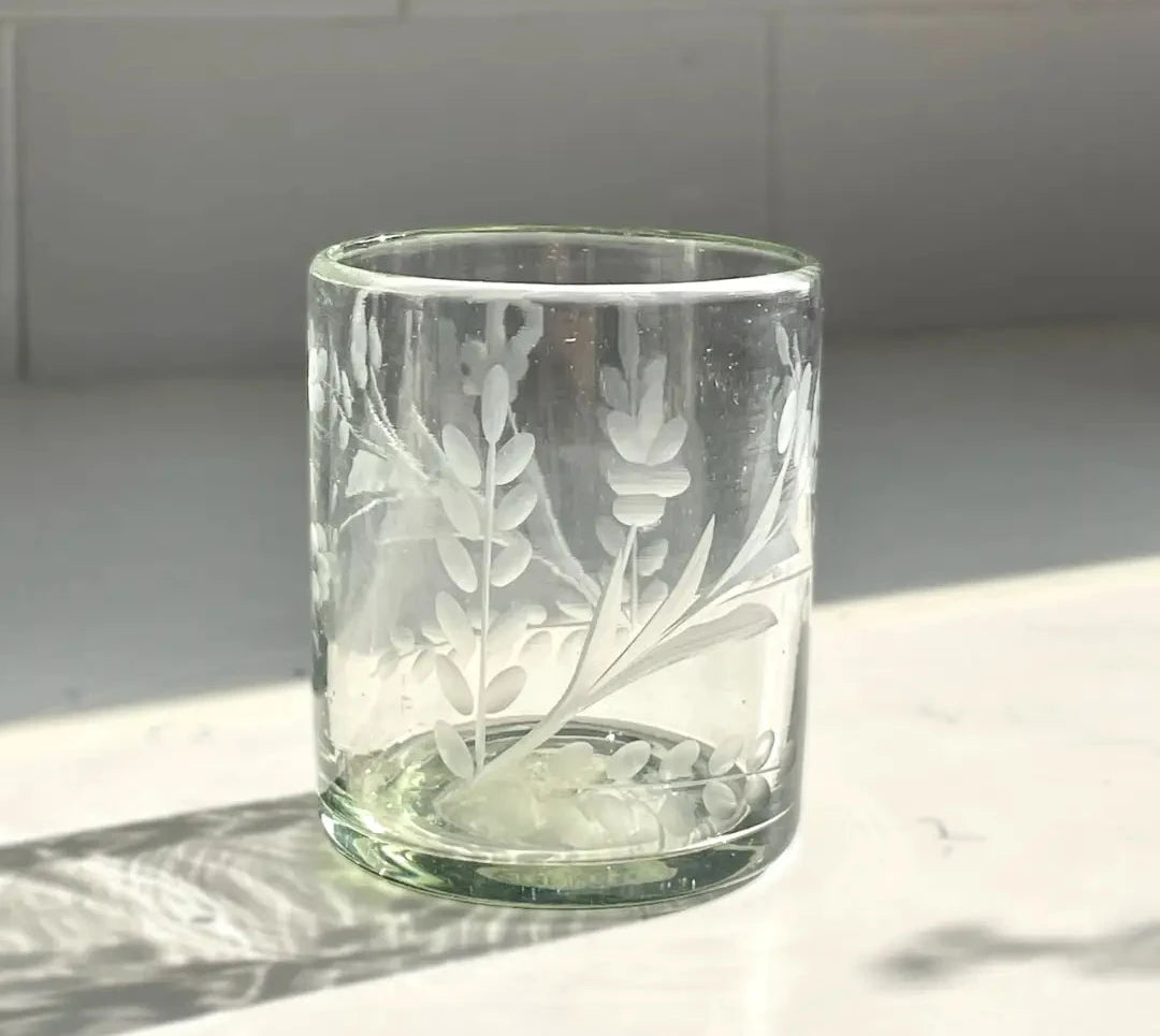 Clear glass tumbler with floral etching