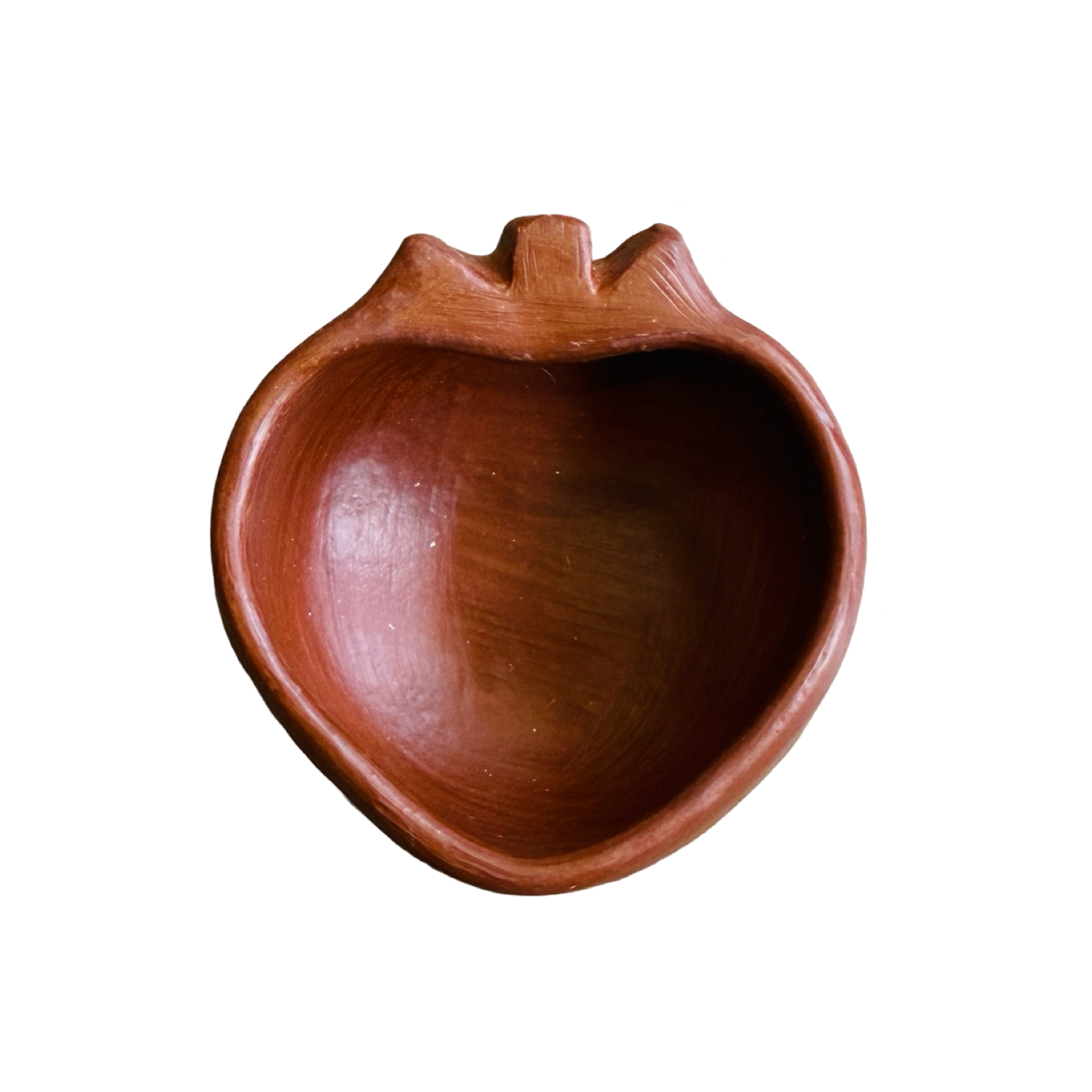 top view of a heart shaped red clay mezcalero