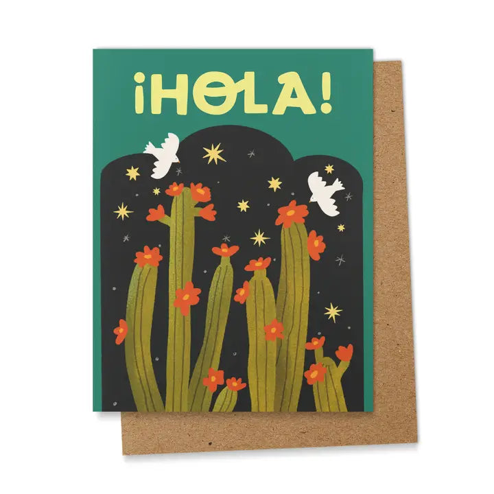 Green and black greeting card with tall green cactus topped with red flowers, white doves, golden stars, and the word “¡Hola!” in bold yellow letters.