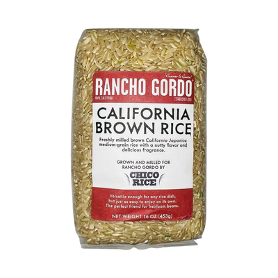 16 oz clear bag of California brown rice with a white and maroon branded label.