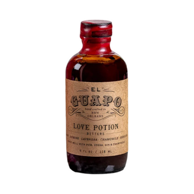 A 4 fl oz bottle of El Guapo's Love Potion Bitters, featuring a brown glass bottle with a wax-sealed cap and a rustic kraft paper label. 