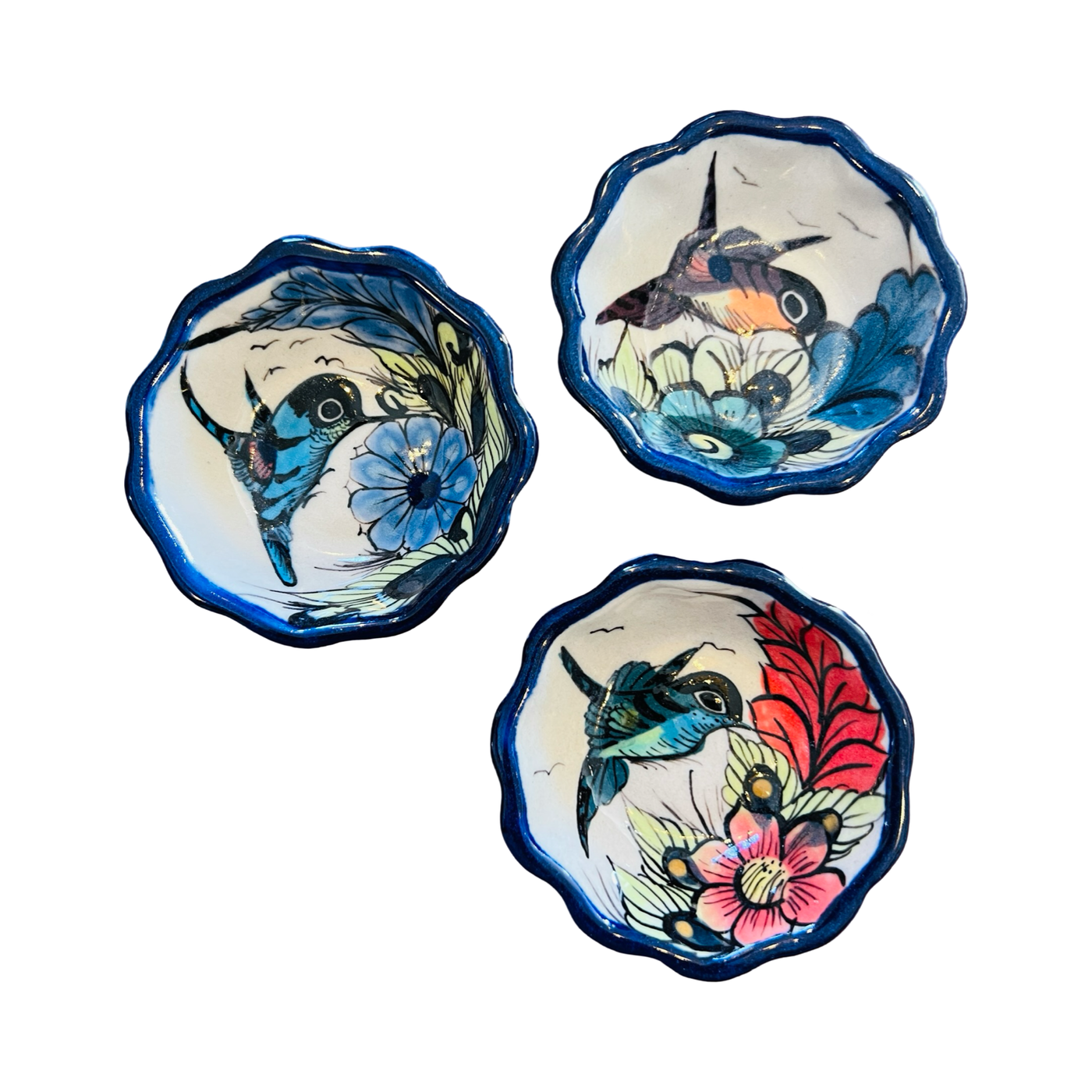 set of 3 round dishes with blue scalloped edges with a bird and flower design.