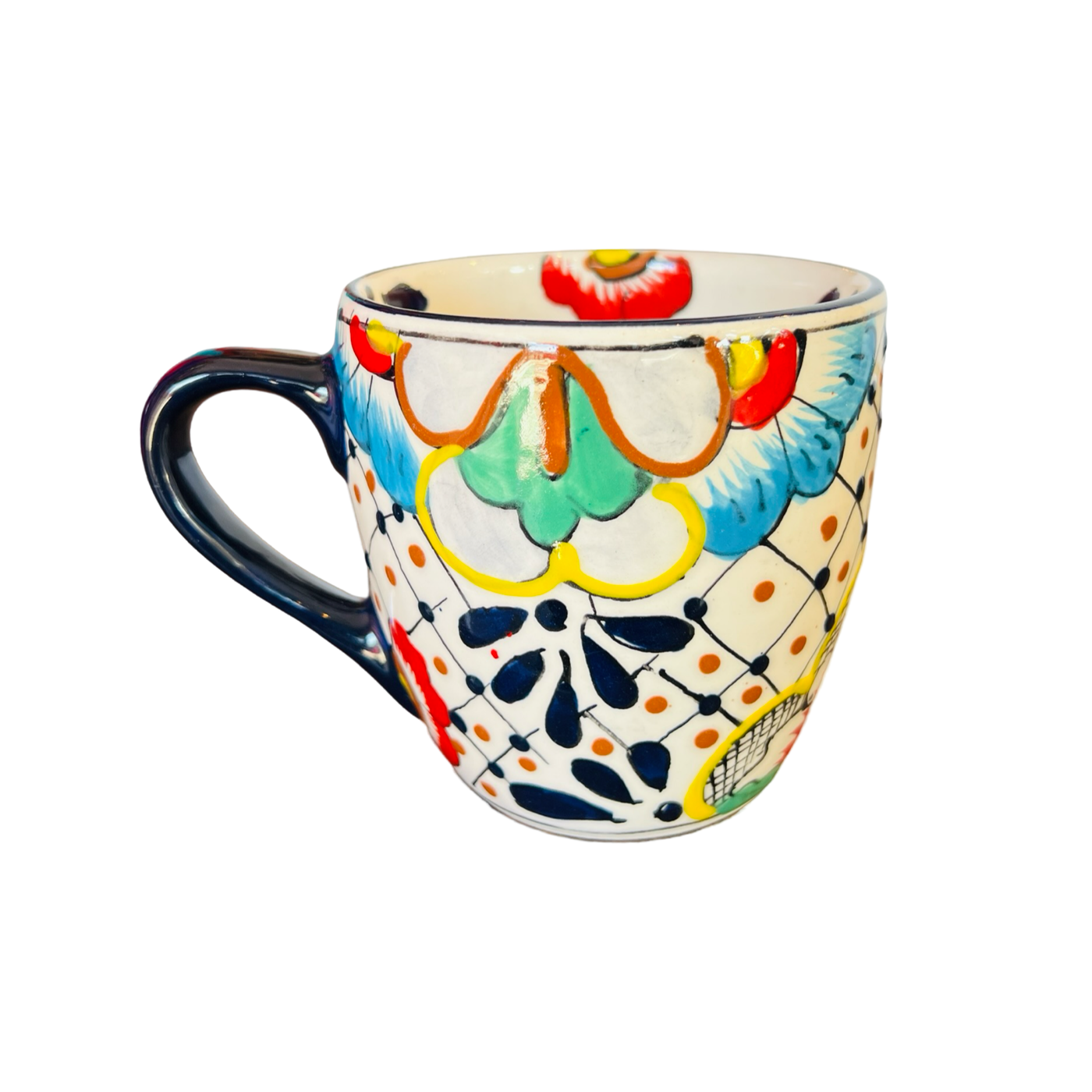 one ceramic mug that features the traditional Mexican talavera design with blues, yellows, reds and black.