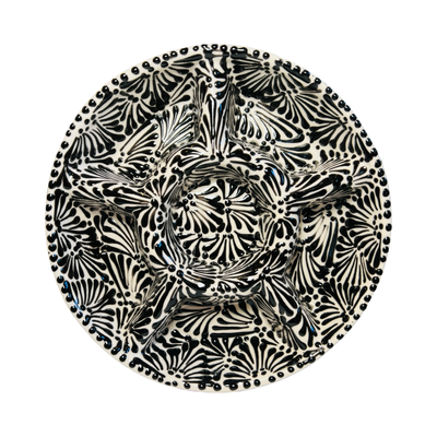 top view of a 6-compartment round appetizer tray with a black and white Puebla design