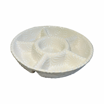 side view of a 6-compartment round appetizer tray with a cream and white Puebla design