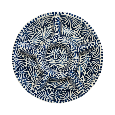 top view of a 6-compartment round appetizer tray with a blue and white Puebla design