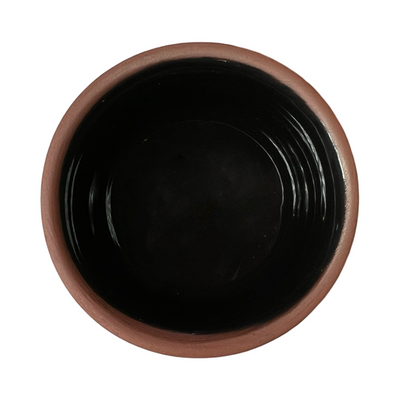 terracotta pinch bowls with an unglazed exterior and glazed interiors in  black