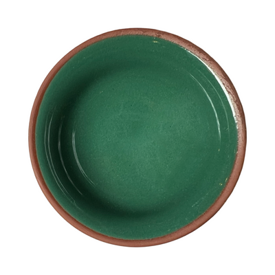 terracotta pinch bowls with an unglazed exterior and glazed interiors in green