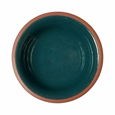 terracotta pinch bowls with an unglazed exterior and glazed interiors in teal